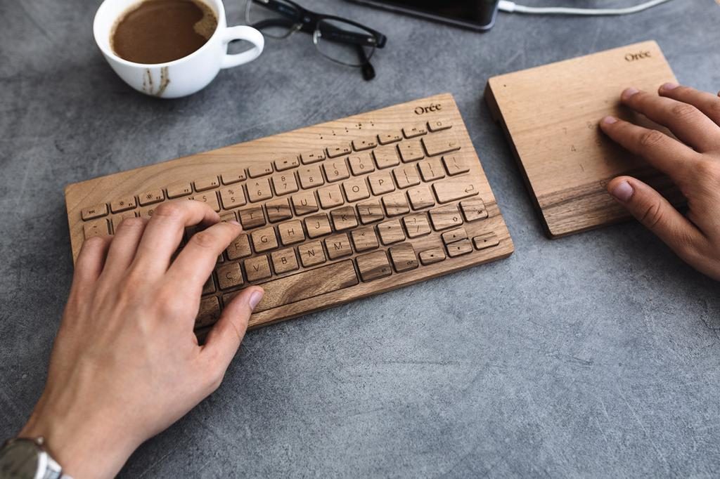 hands-keyboard-trackpad-wood_1024x1024