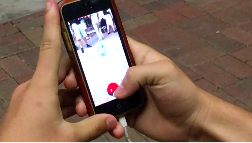 half hundred people play pokemon go outside street for a squirtle 00
