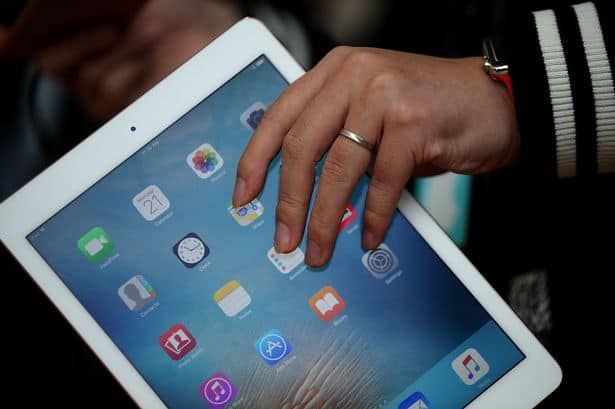 An attendee looks at the new 97 iPad Pro